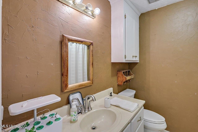 bathroom featuring toilet and vanity