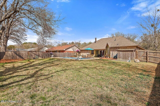 view of yard with a patio, a fenced backyard, and a fenced in pool