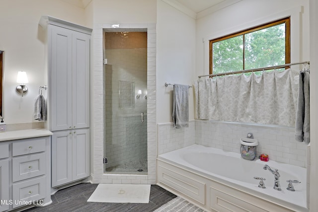 233 Arbor Trl, Brandon, MS 39047 - full bathroom with ornamental molding, a bath, a shower stall, and wood finished floors
