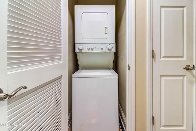 laundry area featuring stacked washer / dryer