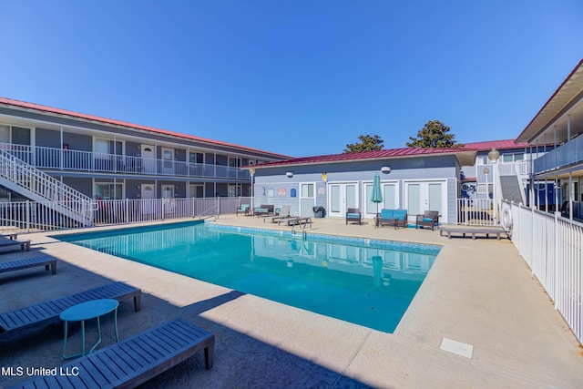 view of pool featuring a patio