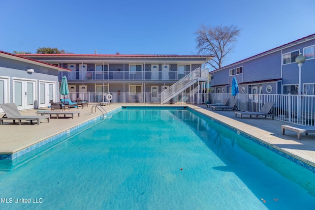 view of swimming pool featuring a patio area