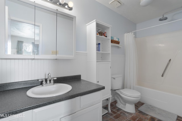 full bathroom featuring vanity, toilet, and shower / bath combo with shower curtain