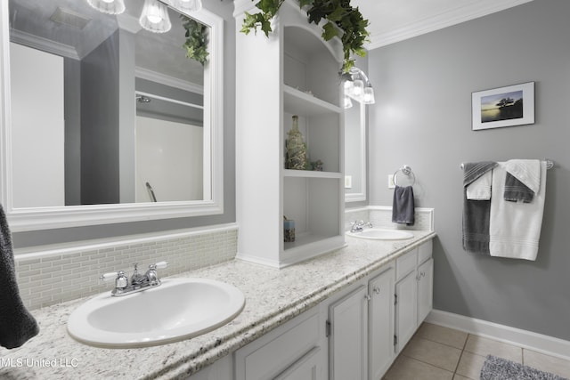 bathroom featuring decorative backsplash, vanity, tile patterned floors, and crown molding