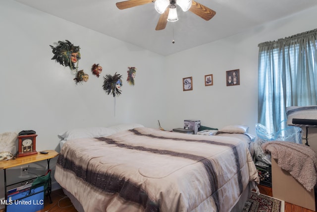 bedroom featuring hardwood / wood-style flooring and ceiling fan