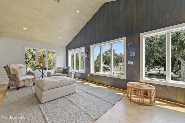 sunroom featuring lofted ceiling and wood ceiling