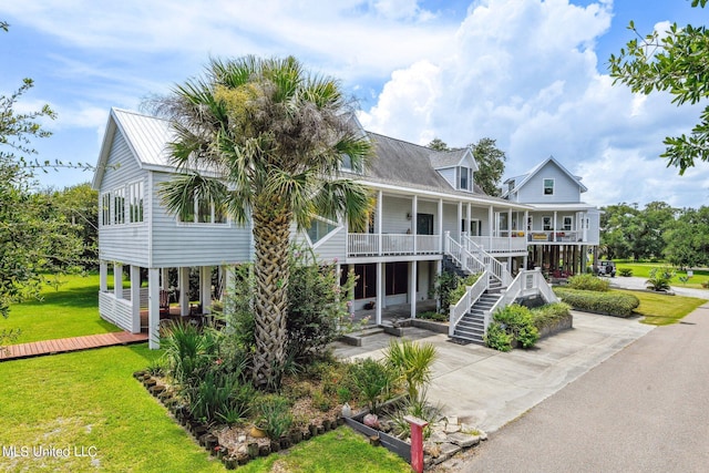 exterior space featuring a porch and a front yard