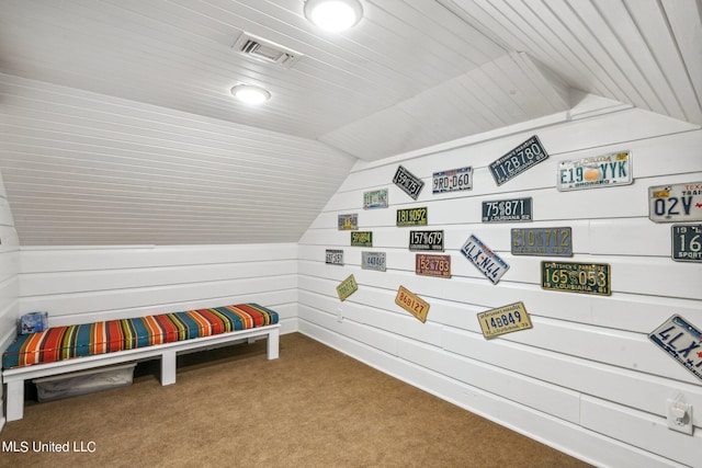 interior space featuring light colored carpet and vaulted ceiling