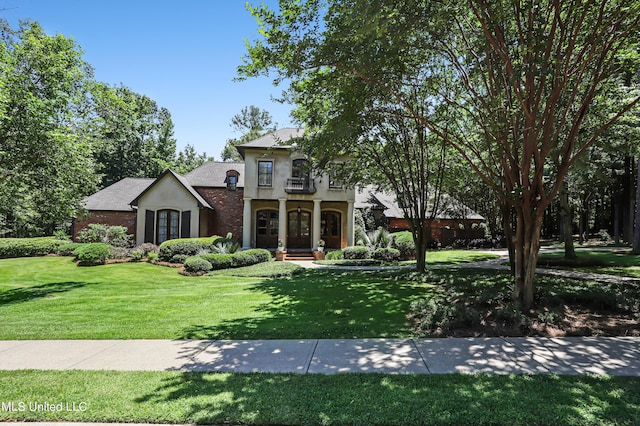 130 Bridgewater Xing, Ridgeland, MS 39157 - view of front of property featuring stucco siding, a front lawn, and french doors