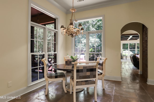 dining area featuring a notable chandelier