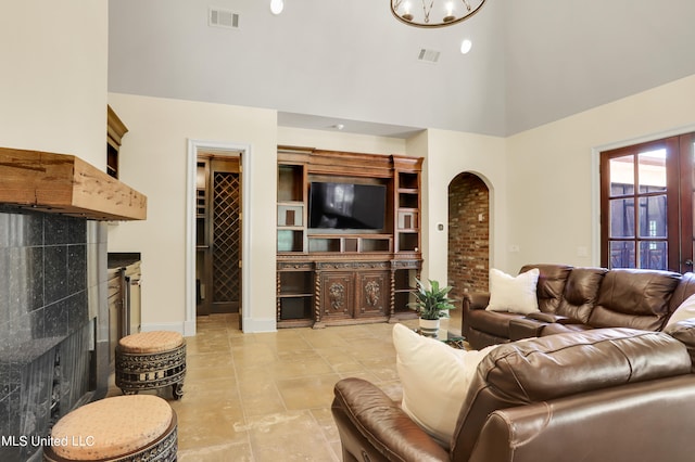 living room with a towering ceiling