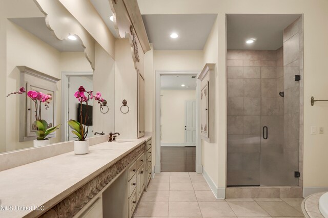 130 Bridgewater Xing, Ridgeland, MS 39157 - bathroom with vanity, tile patterned floors, a stall shower, baseboards, and recessed lighting