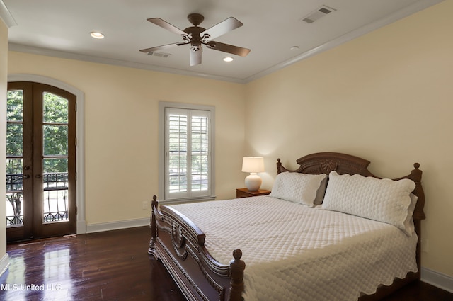 bedroom featuring dark wood-type flooring, ceiling fan, access to outside, and multiple windows