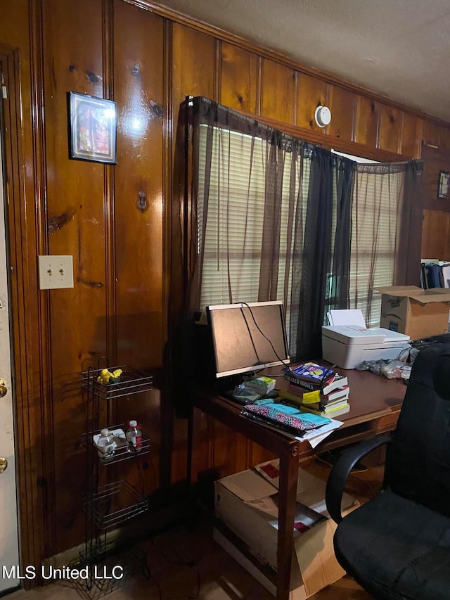 office space featuring wood walls