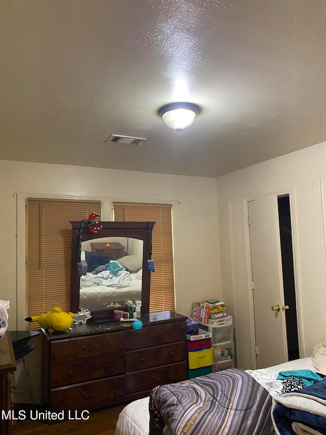 bedroom with a textured ceiling