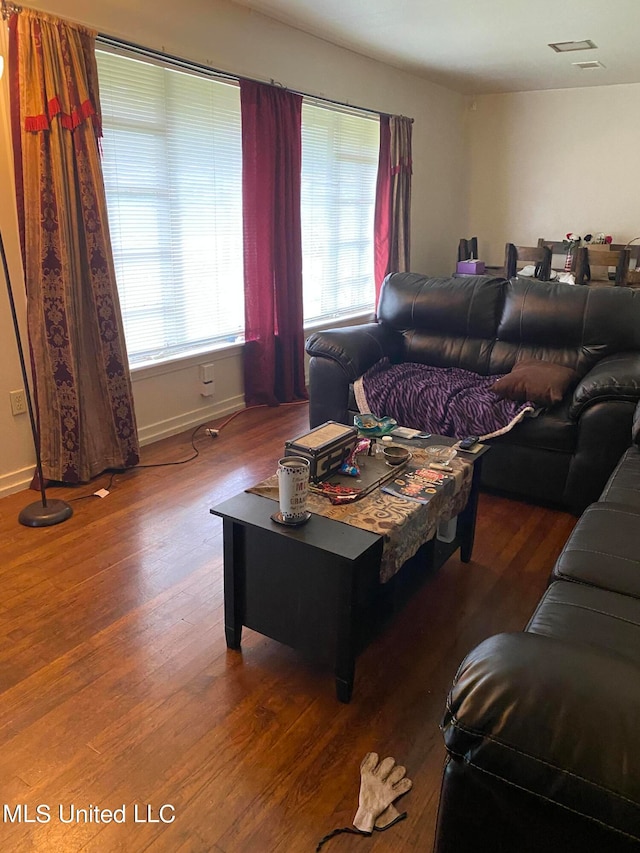 living room with dark hardwood / wood-style flooring