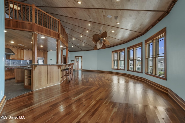 141 Janelle Dr, Bay Saint Louis, MS 39520 - unfurnished living room with wooden ceiling, dark wood-style floors, ceiling fan, baseboards, and recessed lighting