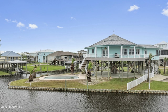 141 Janelle Dr, Bay Saint Louis, MS 39520 - back of property with a water view, stairs, a residential view, a patio, and metal roof