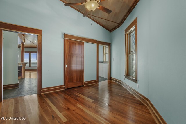 141 Janelle Dr, Bay Saint Louis, MS 39520 - unfurnished bedroom with lofted ceiling, baseboards, and wood finished floors