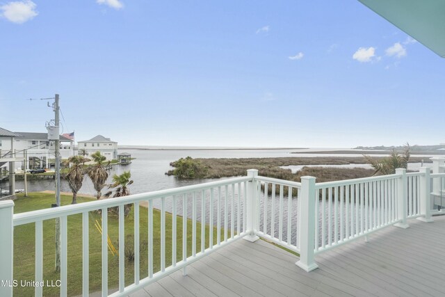 141 Janelle Dr, Bay Saint Louis, MS 39520 - wooden terrace with a water view and a lawn
