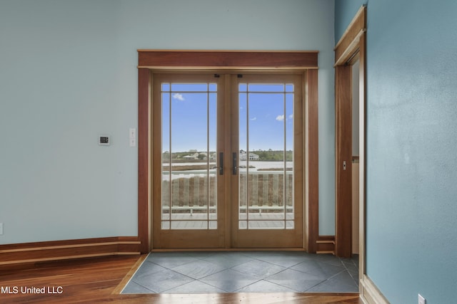 141 Janelle Dr, Bay Saint Louis, MS 39520 - doorway to outside featuring french doors, baseboards, and tile patterned flooring