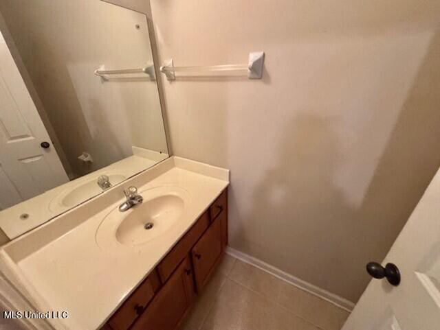 7428 Wallingford Dr, Olive Branch, MS 38654 - bathroom featuring vanity, tile patterned flooring, and baseboards