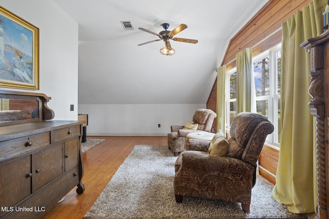 130 Pine Lake Cv, Flora, MS 39071 - living area featuring visible vents, lofted ceiling, baseboards, ceiling fan, and light wood-type flooring