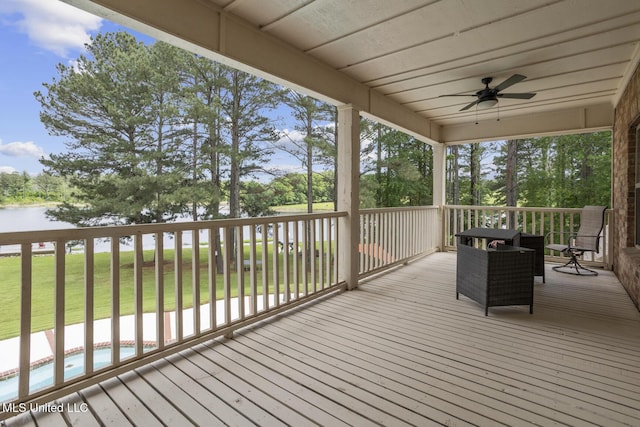 130 Pine Lake Cv, Flora, MS 39071 - deck with a water view, a ceiling fan, and an outdoor pool