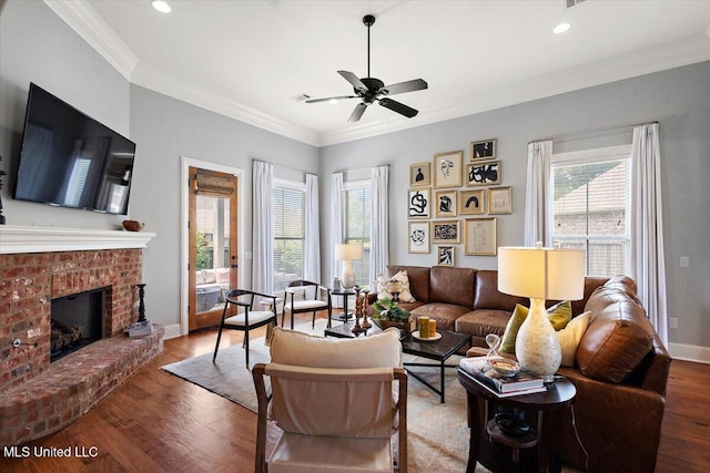 102 Hampton Chase, Madison, MS 39110 - living room featuring a ceiling fan, wood finished floors, a fireplace, crown molding, and recessed lighting