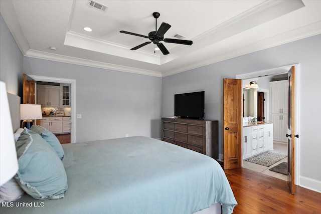 102 Hampton Chase, Madison, MS 39110 - bedroom featuring a raised ceiling, crown molding, wood finished floors, ensuite bath, and recessed lighting