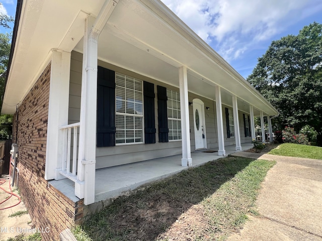 view of property exterior featuring covered porch