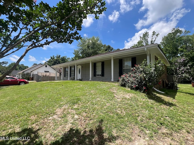 ranch-style house with covered porch and a front lawn