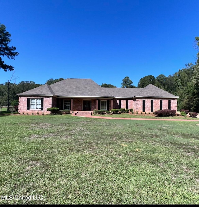 ranch-style home with a front yard