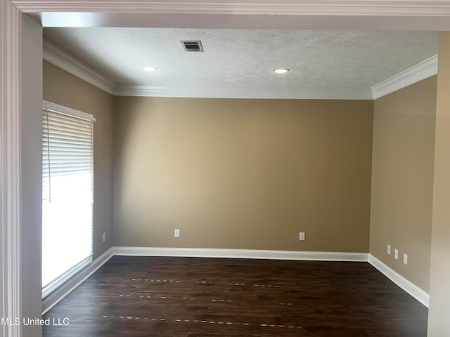 unfurnished room with dark hardwood / wood-style flooring, a textured ceiling, and ornamental molding