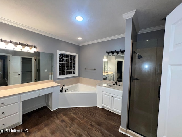 bathroom featuring independent shower and bath, vanity, wood-type flooring, and crown molding