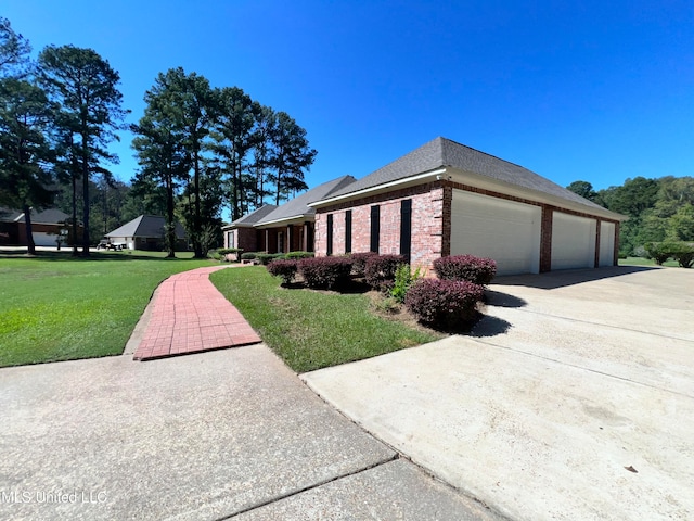 view of property exterior with a garage and a lawn