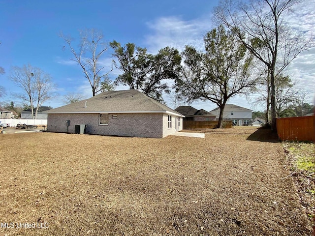 rear view of house with central AC