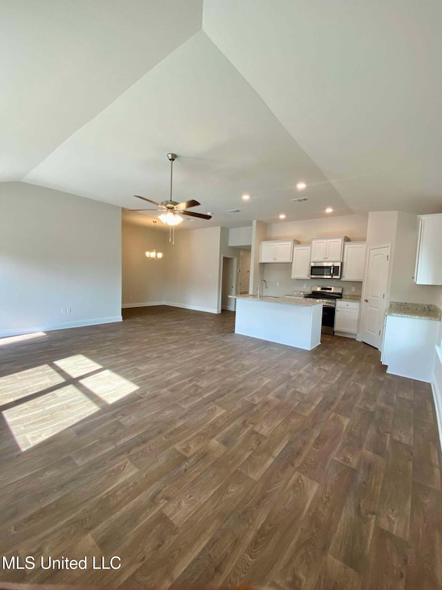 unfurnished living room with ceiling fan, lofted ceiling, dark hardwood / wood-style floors, and sink