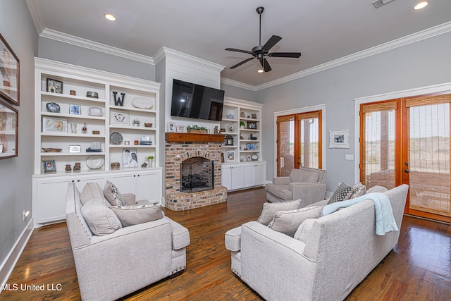 living area featuring a wealth of natural light, dark wood-style flooring, and crown molding