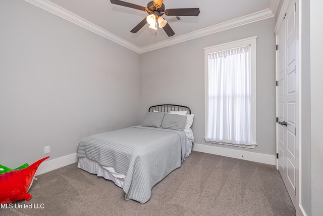 carpeted bedroom featuring ceiling fan, ornamental molding, and baseboards