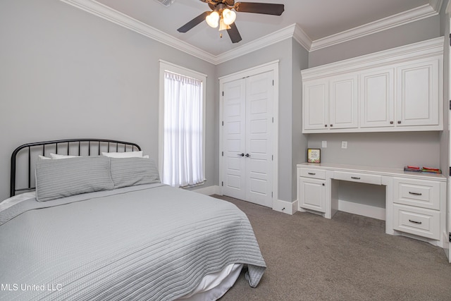 bedroom featuring light carpet, baseboards, built in study area, crown molding, and a closet