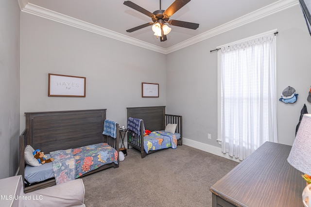 carpeted bedroom with baseboards, ceiling fan, and crown molding