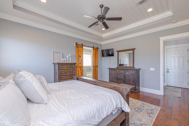 bedroom with baseboards, visible vents, a raised ceiling, dark wood-style floors, and ornamental molding