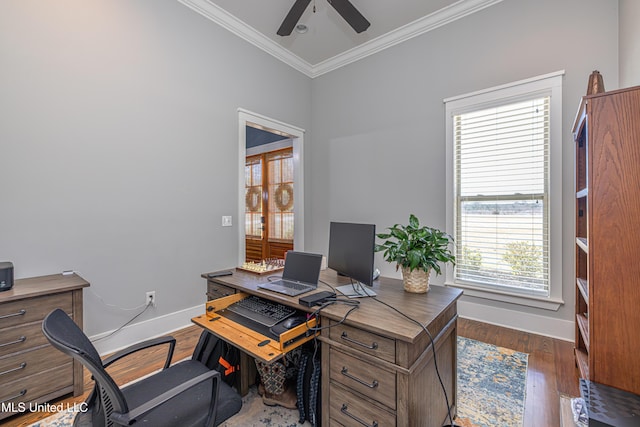 office area with ornamental molding, wood finished floors, a ceiling fan, and baseboards