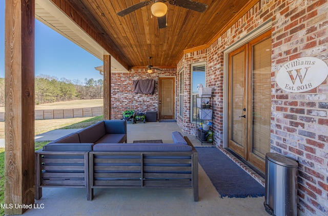 view of patio with an outdoor living space and a ceiling fan