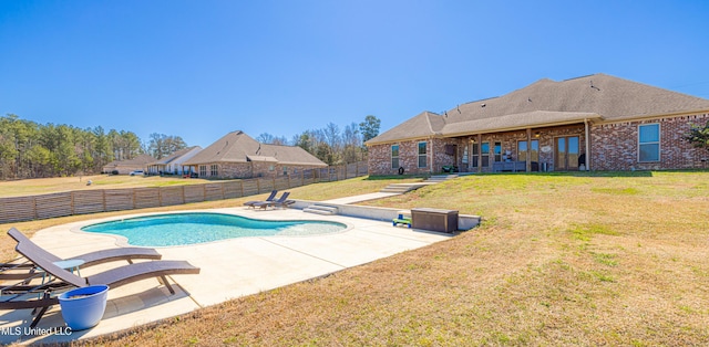 view of swimming pool with a patio area, a fenced backyard, a fenced in pool, and a yard