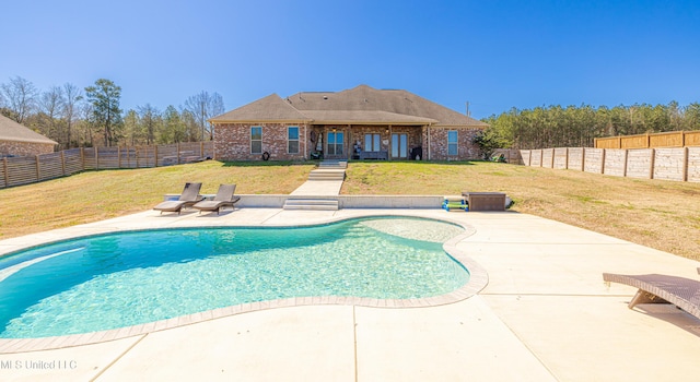 view of pool with a fenced backyard, a fenced in pool, a lawn, and a patio