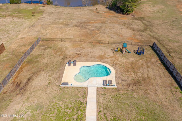 view of swimming pool with fence