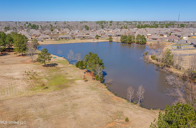 drone / aerial view with a residential view and a water view