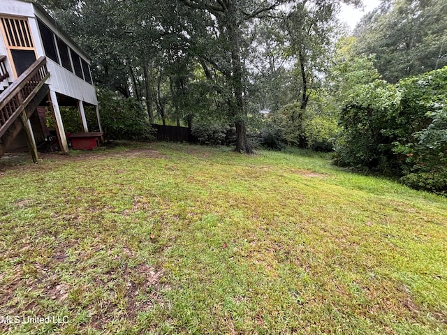 view of yard with a sunroom